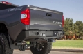 Picture of Addictive Desert Designs 2014+ Toyota Tundra Stealth Fighter Rear Bumper w- Backup Sensor Cutouts