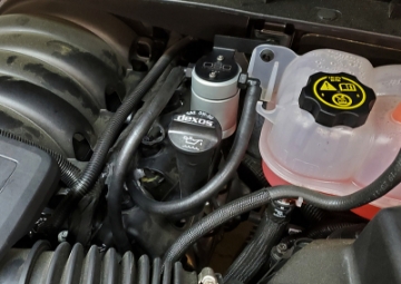 Picture of J&L 19-26 Chevrolet Silverado-GMC Sierra 1500 5-3L V8 Driver Side Oil Separator 3-0 - Clear Anod