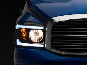 Picture of Raxiom 06-09 Dodge RAM 1500-2500-3500 Axial Headlights w- SEQL LED Bar- Blk Housing Clear Lens