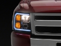 Picture of Raxiom 07-13 Chevrolet Silverado 1500 Axial Headlights w- SEQL LED Bar- Blk Housing Clear Lens