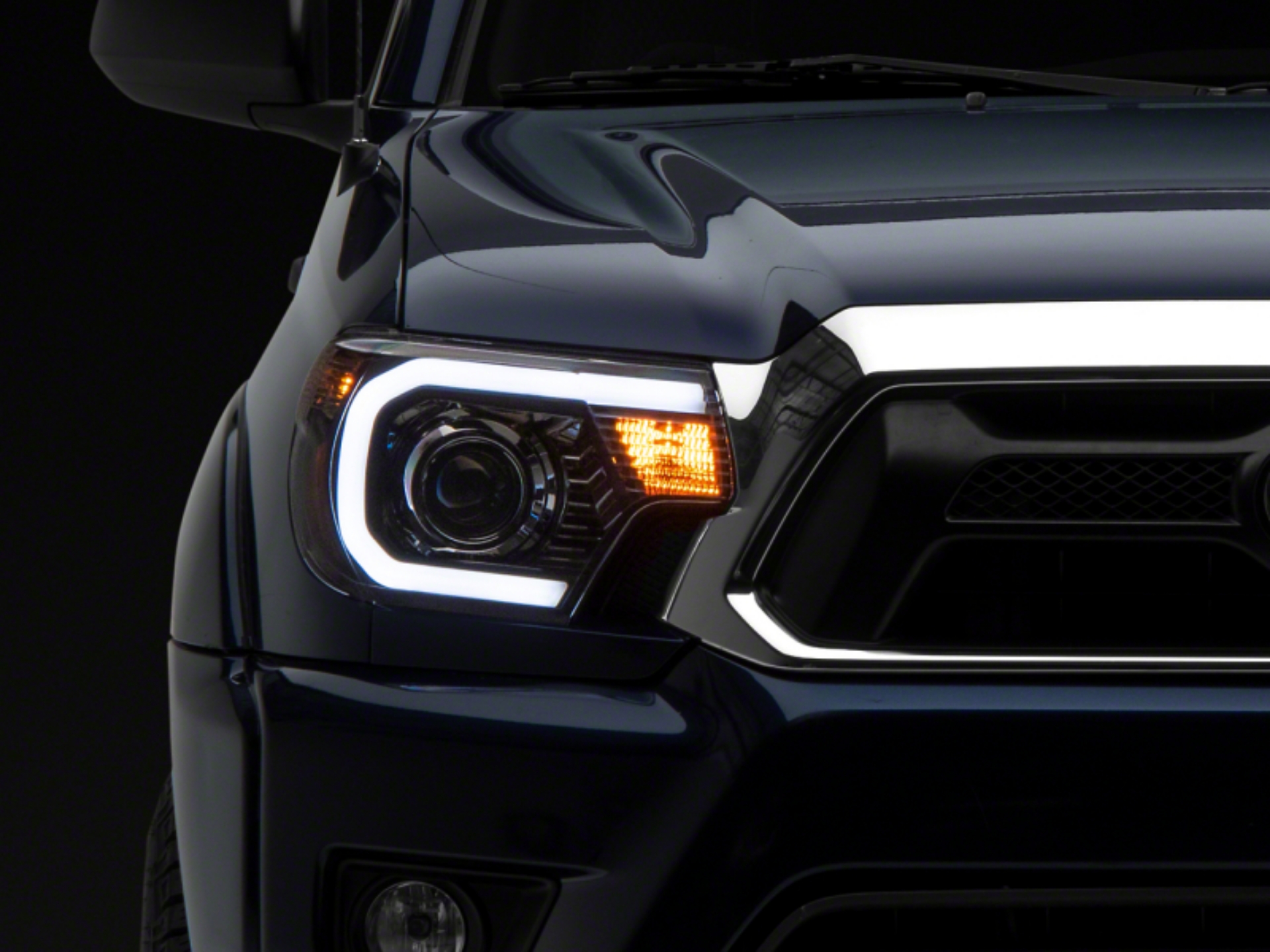 Picture of Raxiom 12-15 Toyota Tacoma Axial Projector Headlights w- SEQL LED Bar- Blk Housing Clear Lens