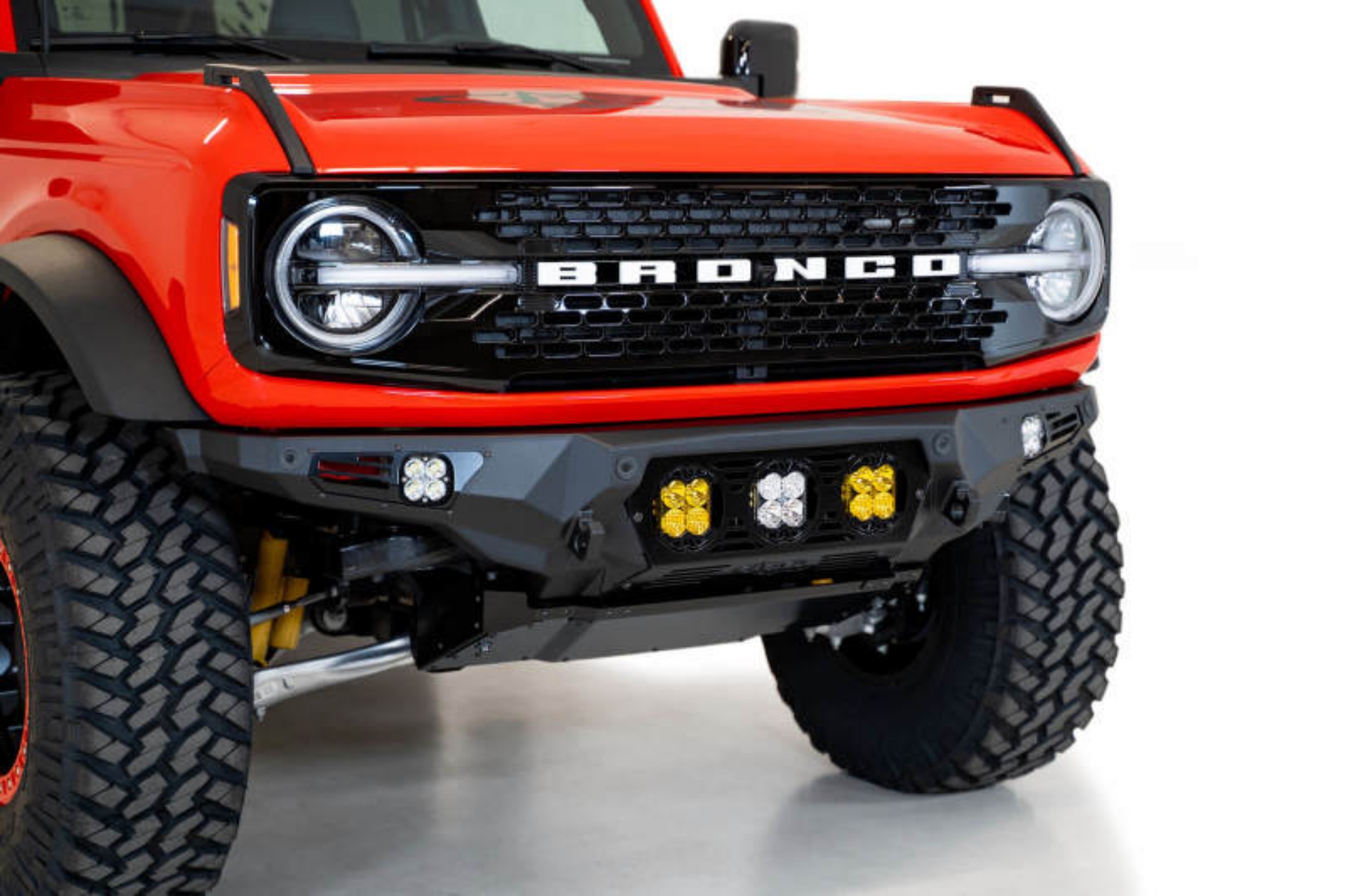 Picture of Addictive Desert Designs 21-22 Ford Bronco Bomber Front Bumper w- 3 Baja Designs LP4 Mounts