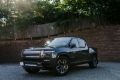 Picture of Rally Armor 22-25 Rivian R1T Black UR Mud Flap w-Tangerine Scream Logo