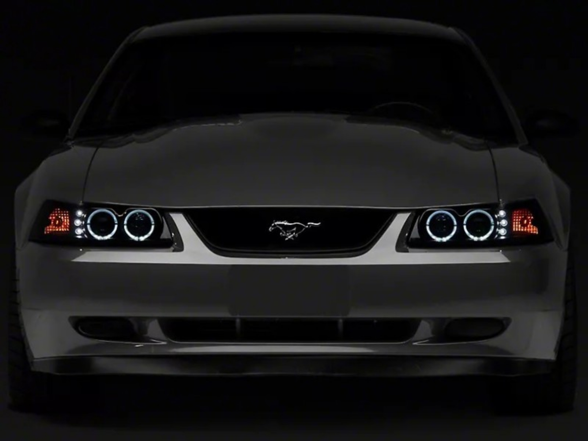 Picture of Raxiom 99-04 Ford Mustang Dual LED Halo Projector Headlights- Black Housing Smoked Lens