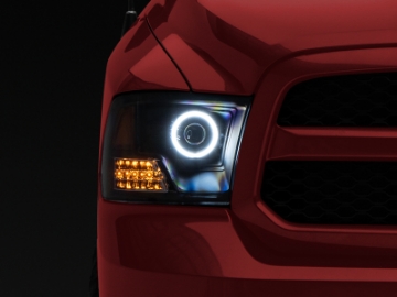 Picture of Raxiom 09-18 RAM 1500 Super White LED Halo Projector Headlights- Black Housing Clear Lens