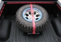 Picture of N-Fab Bed Mounted Rapid Tire Strap Universal - Gloss Black - Red Strap