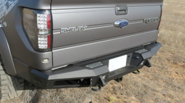 Picture of Addictive Desert Designs 10-14 Ford F-150 Raptor HoneyBadger Rear Bumper w/ Tow Hooks