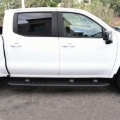 Picture of Westin 2019 Chevrolet Silverado/Sierra 1500 Crew Cab Thrasher Running Boards - Textured Black