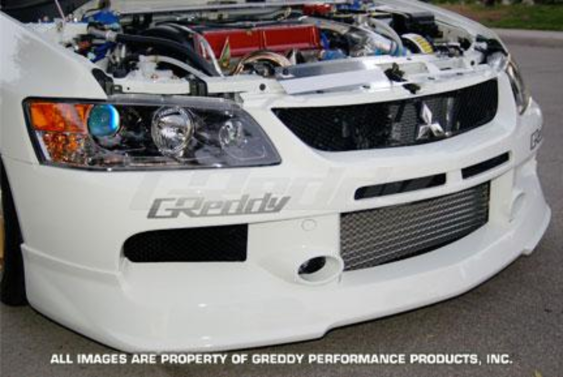 Picture of GReddy 06-07 Mitsubishi Evolution IX Urethane Front Lip Spoiler  **Must Ask/Call to Order**