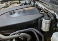Picture of J&L 16-23 Toyota Tacoma 3.5L Driver Side Oil Separator 3.0 - Clear Anodized