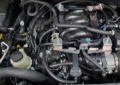 Picture of J&L 16-24 Nissan Titan 5.6L Passenger Side Oil Separator 3.0 - Black Anodized