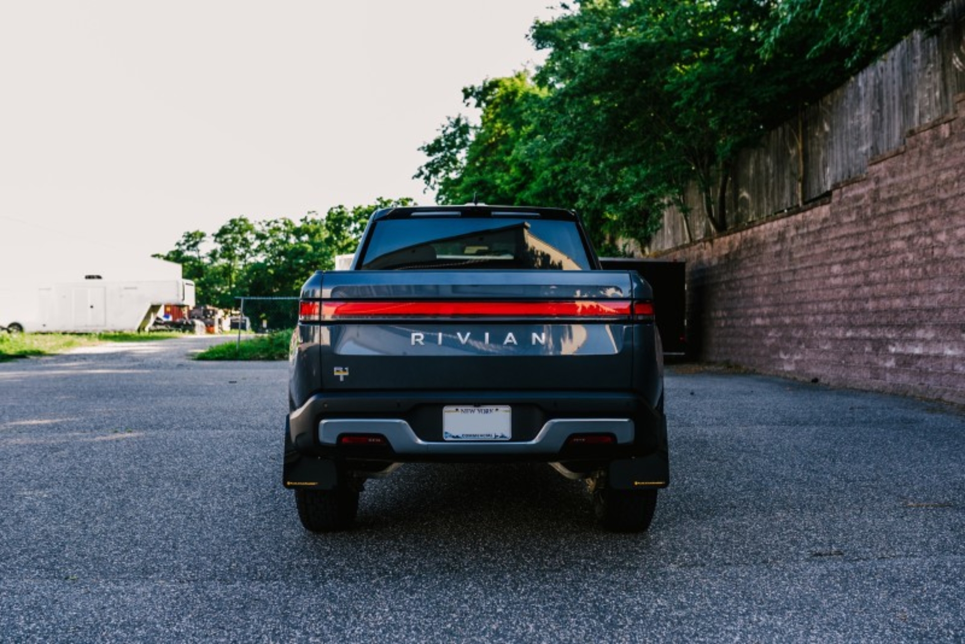 Picture of Rally Armor 22-25 Rivian R1T Black UR Mud Flap w/Tangerine Scream Logo