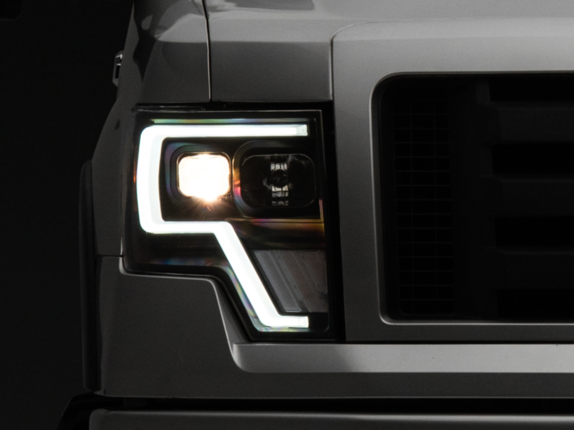 Picture of Raxiom 09-14 Ford F-150 G4 Projector Headlights- Black Housing (Clear Lens)