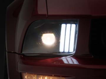 Picture of Raxiom 05-09 Ford Mustang w/ Halogen Projector Headlights- Black Housing (Clear Lens) (No GT500 )