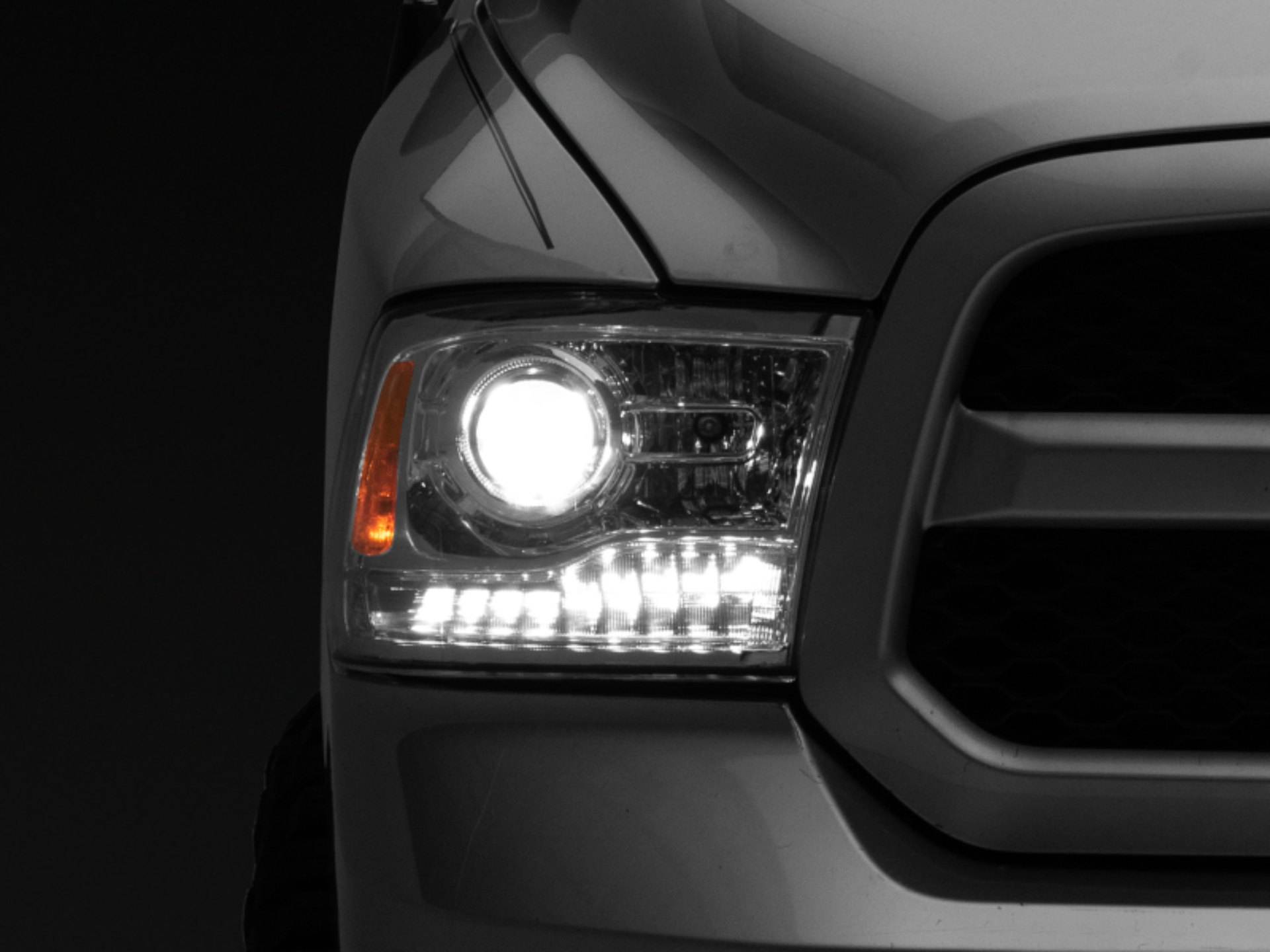 Picture of Raxiom 09-18 Dodge RAM 1500 LED Halo Headlights w/ Switchback Turn Signals- Chrome Hsng (Clear Lens)