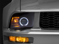 Picture of Raxiom 05-09 Ford Mustang Halogen 2010 Style LED Halo Headlights-Blk Hsng(Clear Lens/Excludes GT500)