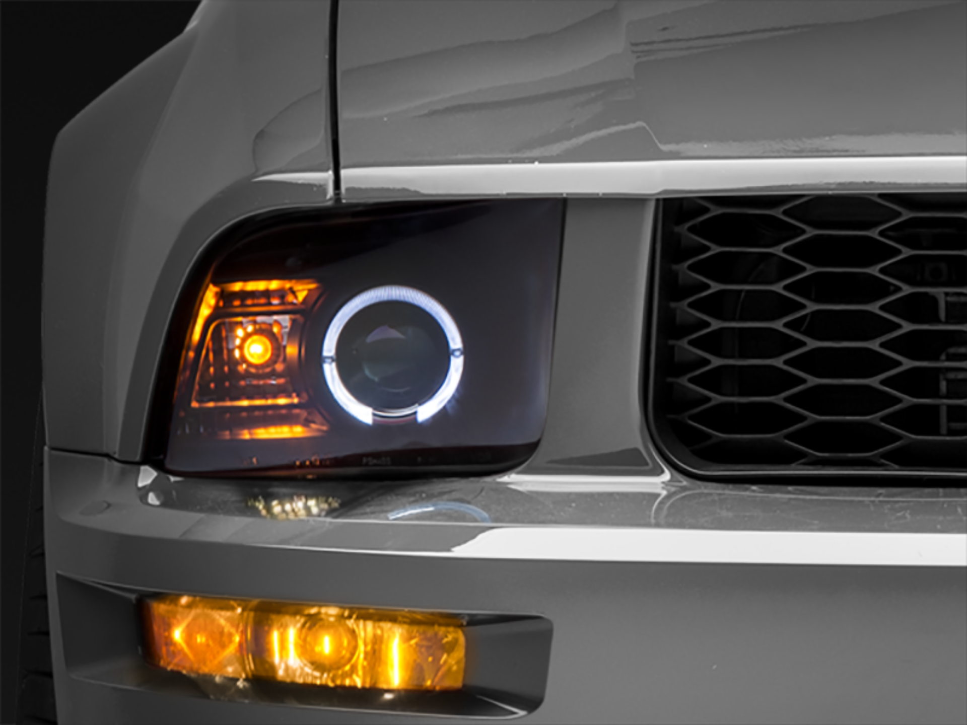 Picture of Raxiom 05-09 Ford Mustang Halogen 2010 Style LED Halo Headlights-Blk Hsng(Clear Lens/Excludes GT500)