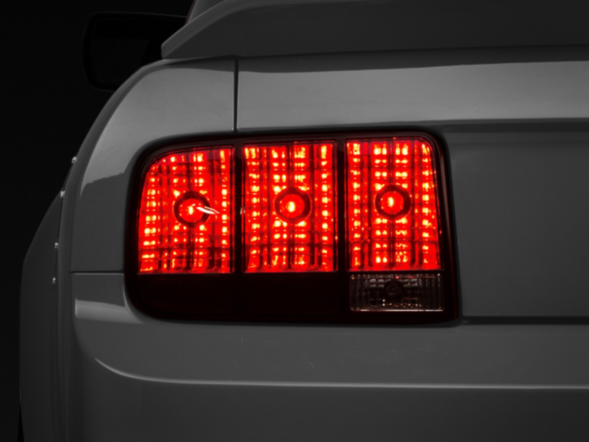 Picture of Raxiom 05-09 Ford Mustang Tail Lights- Black Housing (Smoked Lens)