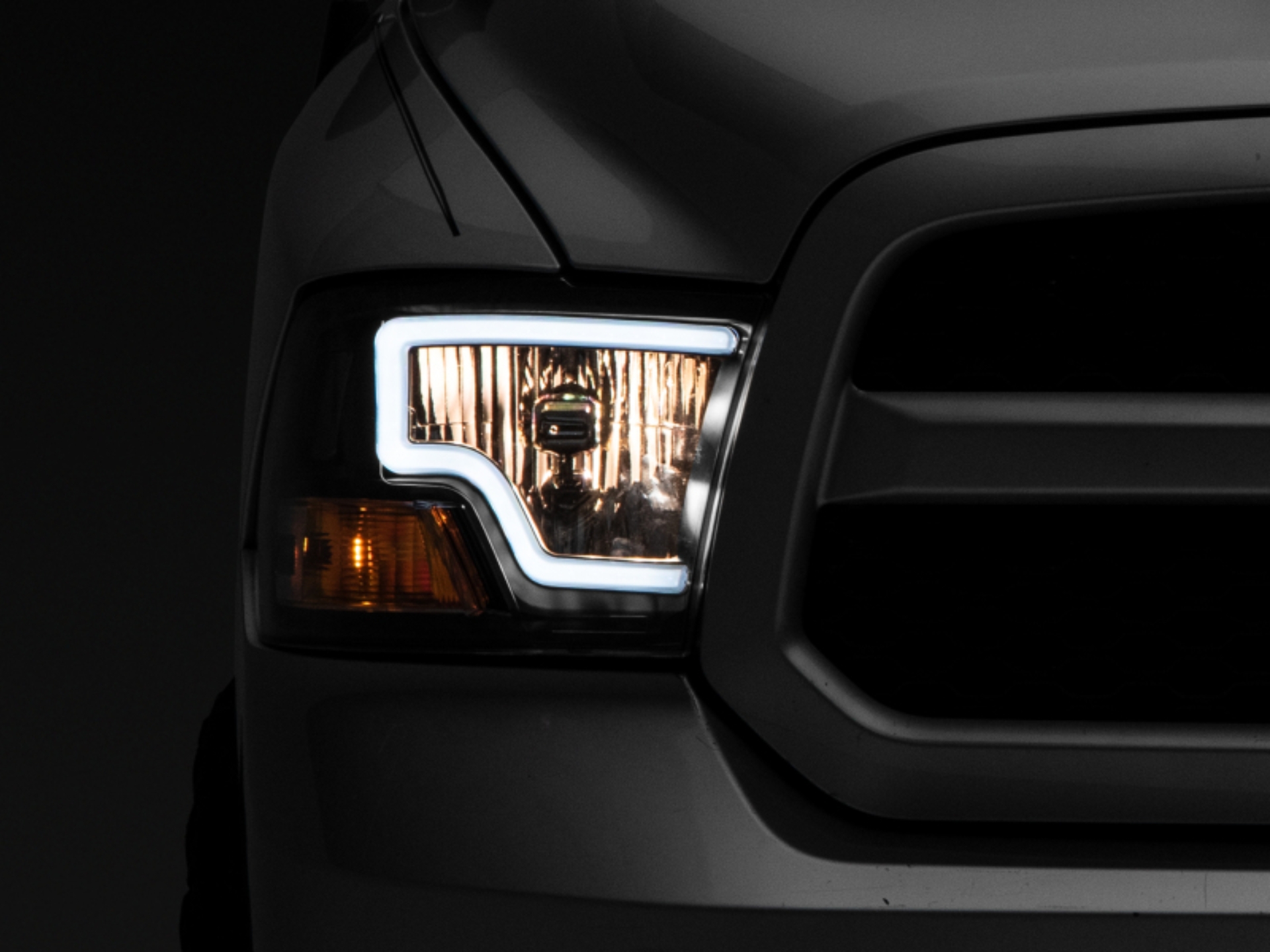 Picture of Raxiom 09-18 Dodge RAM 1500 LED Bar Headlights- Black Housing (Clear Lens)