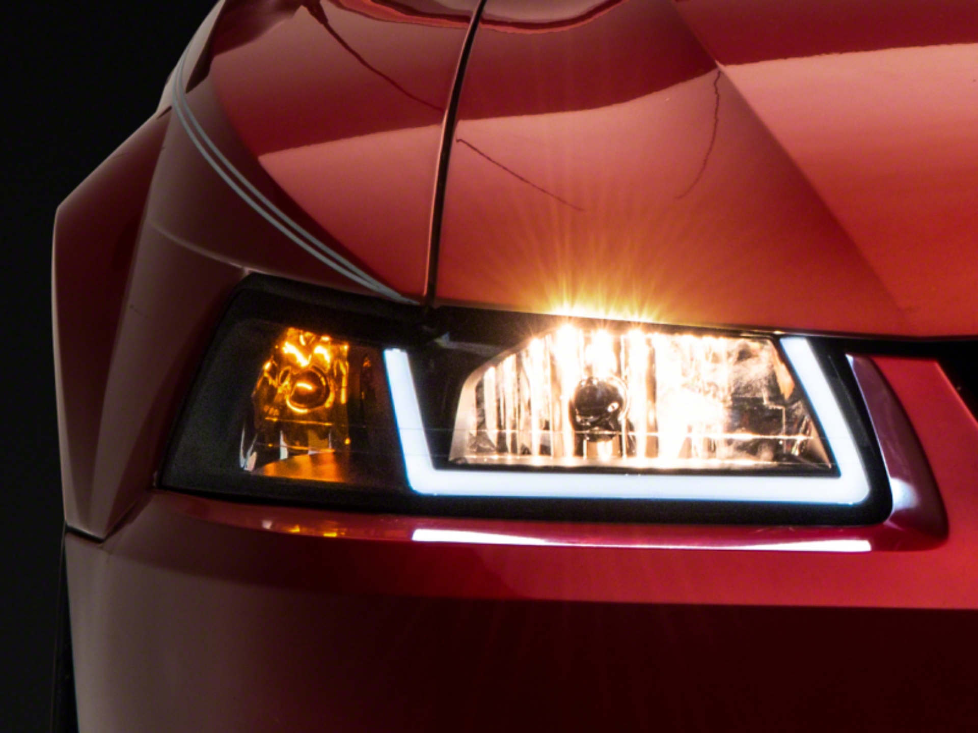Picture of Raxiom 99-04 Ford Mustang Axial Series Headlights w/ LED Bar- Black Housing (Clear Lens)