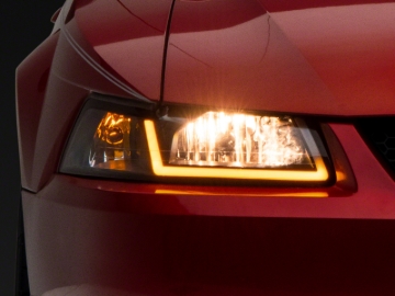 Picture of Raxiom 99-04 Ford Mustang Axial Series Headlights w/ Sequential LED Bar- Black Housing (Clear Lens)