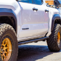 Picture of Cali Raised 2024+ Toyota Tacoma Trail Ed Rock Sliders - Double Cab Long Bed/Kick Out/PwdrCoat