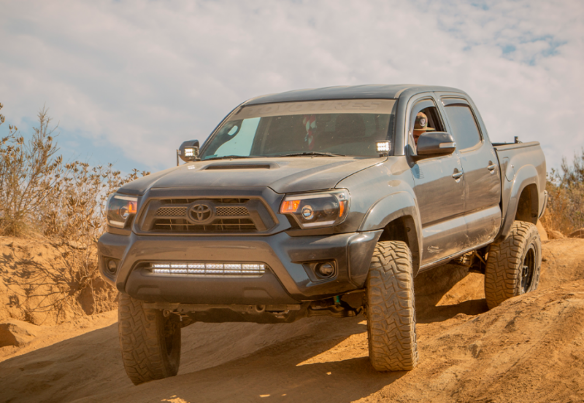 Picture of Cali Raised 05-15 Toyota Tacoma Low Prof Ditch Light Brackets Kit W/ Amber Backlight - Tall