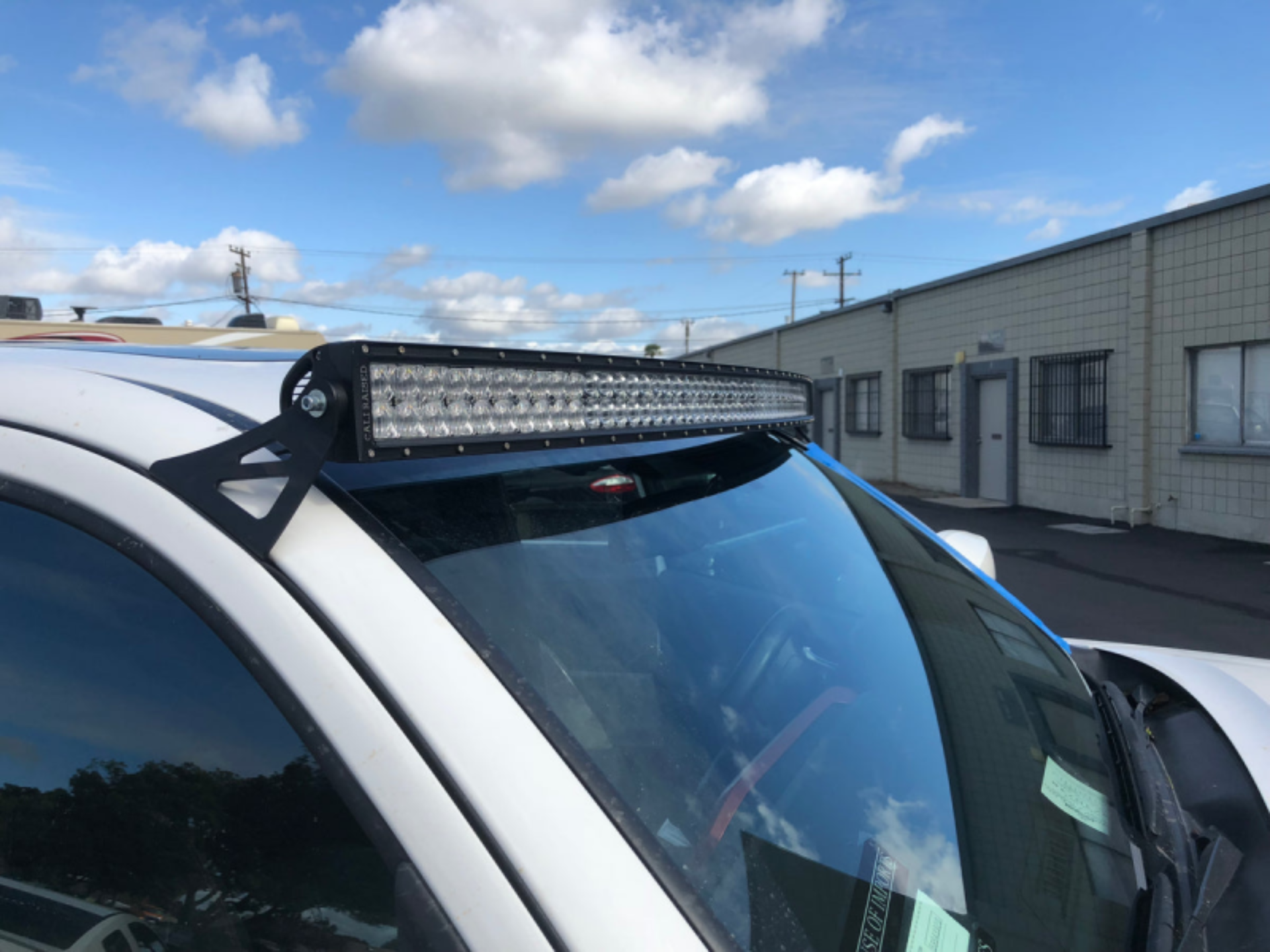 Picture of Cali Raised 05-23 Toyota Tacoma 52 Curved Led Light Bar Roof Brackets Kit - Brackets W/ 5D Optic Os