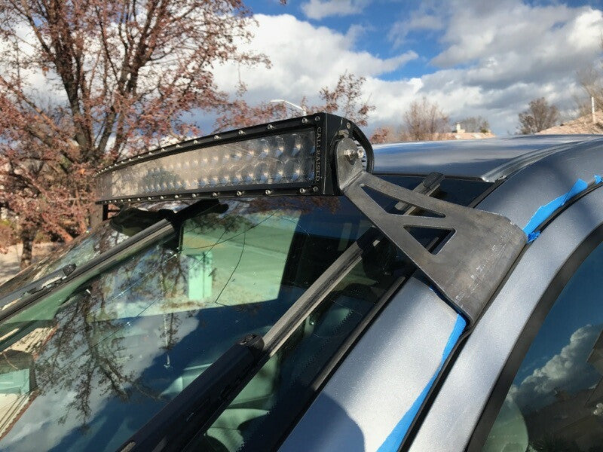 Picture of Cali Raised 2007-2021 Toyota Tundra 52 Curved Led Light Bar Roof Brackets Kit - W/5D Optic Osram