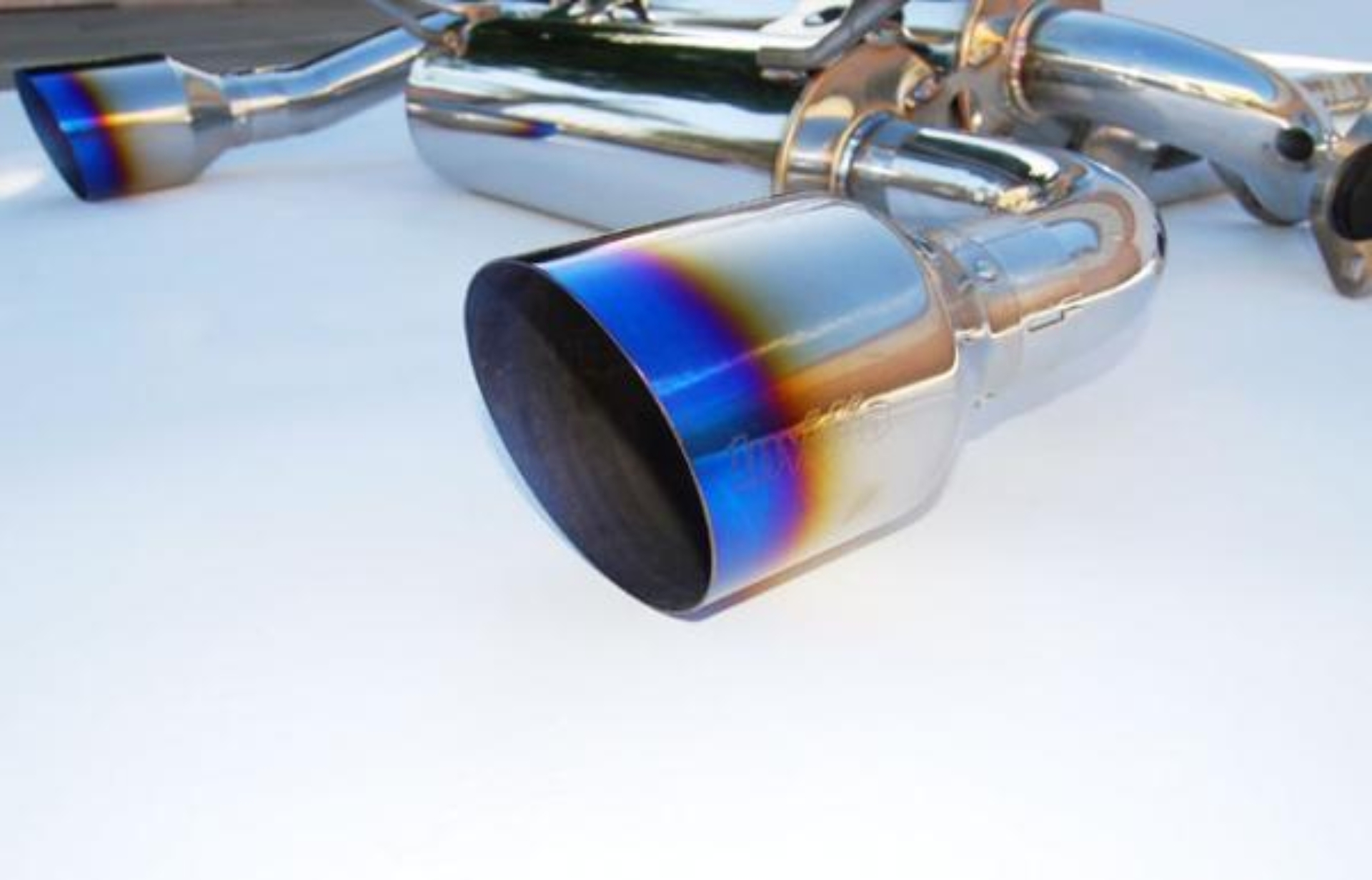 Picture of Invidia 03-08 Infiniti G35 Coupe Gemini Single Layer Titanium Tip Cat-back Exhaust