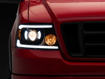 Picture of Raxiom 04-08 Ford F-150 Axial Series Projector Headlights with LED Bar- Black Housing- Clear Lens